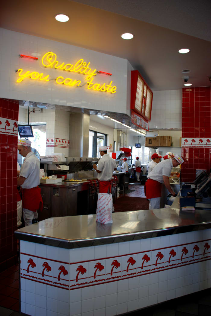 The busy INO "stand" (kitchen). Typically, there are about 12–14 people working per shift, not including managers. Busier/quieter shifts require more/less associates.