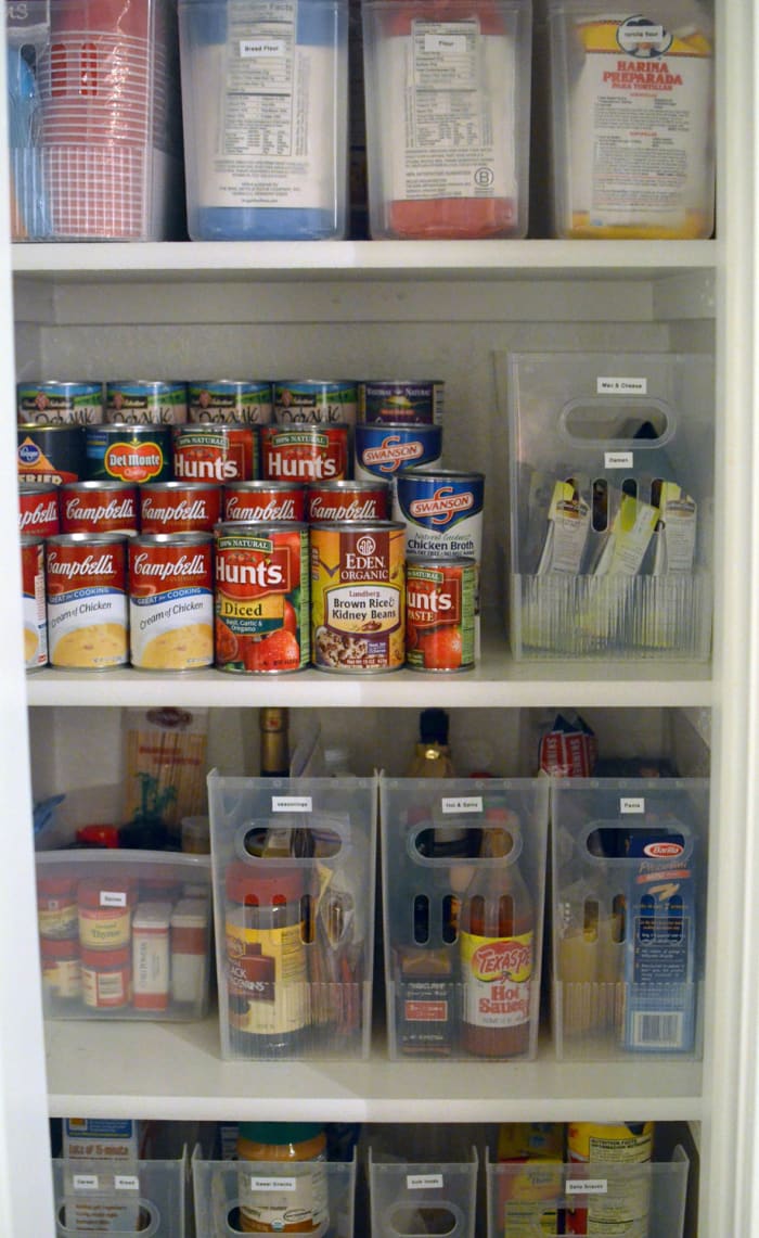A tiered cabinet organizer makes it simple for these homeowners to find the cans that they need quickly and easily.