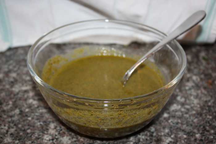 Stir in vinegar, oregano, salt, lemon zest, pepper, and red pepper flakes. Add oil and stir to combine.