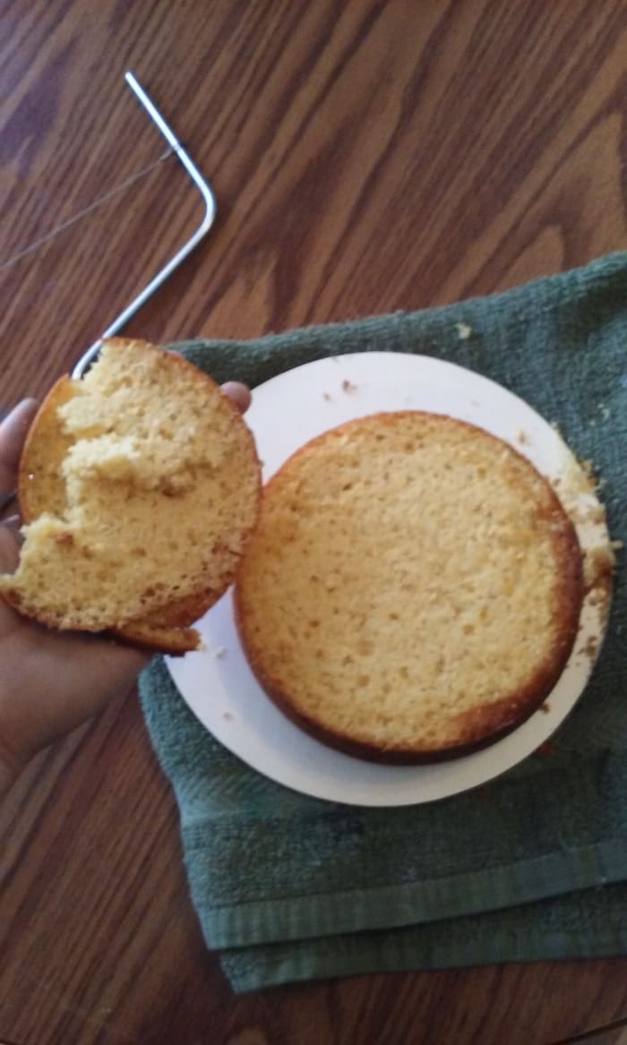 Given, this is a double-leveled cake just for this tutorial. But I have noticed that using the leveler will make you lose a lot more cake than using a bread knife.