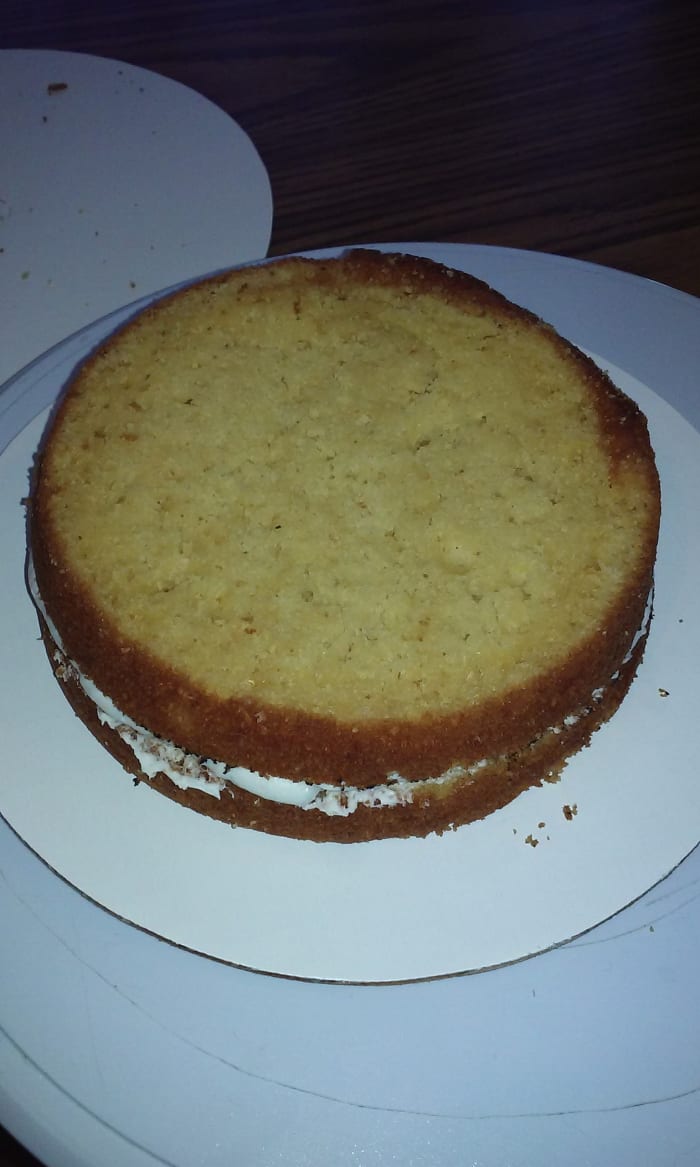 And that's it! Make sure you put the top back on evenly and press down a little to seal the layers together. This cake is now ready for a crumb coat!