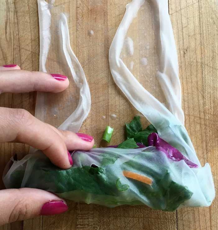 You'll notice a tiny little tear right smack dab in the middle of my roll! Do not fret if this happens to you—because it probably will a few times. There is enough wrapper to cover up these little tears and prevent the veggies from coming out.