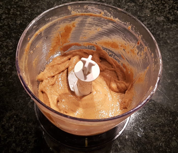 Step 2: To this mixture, add the cumin, salt and olive oil and process on high speed to mix. (This is also where you can add your optional ingredients like red peppers, garlic or chilies.)