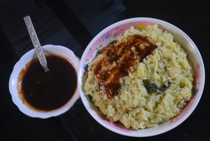 Add the tempering, the ground mixture, turmeric powder, lemon juice, and salt to the cooked rice-lentil mixture as per instructions. Turn off the heat after cooking for some time and they combine well. Your favorite khara pongal is ready to serve!