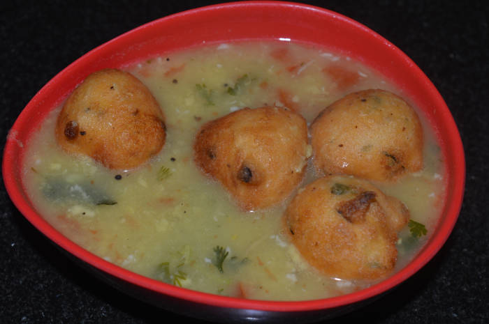 Step eleven: Serve 3-4 ladles of soup in a bowl. Place 3-4 lentil balls on this piping hot soup. Happy eating!