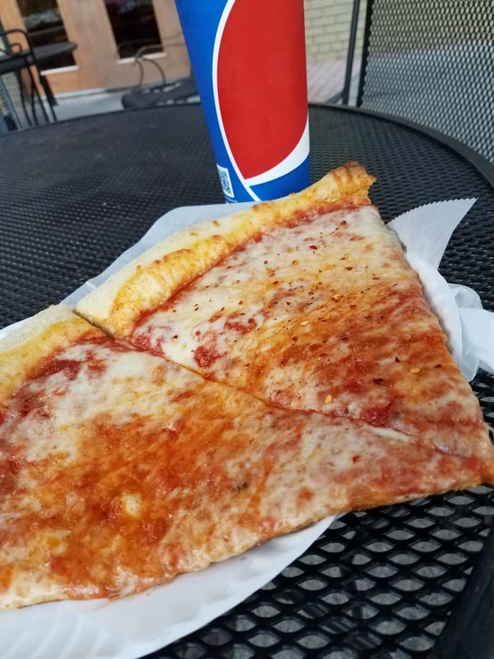 Nina's....formerly Mamma Nina's. 2 slices and a Pepsi for $4.00? I caught a deal on this day!