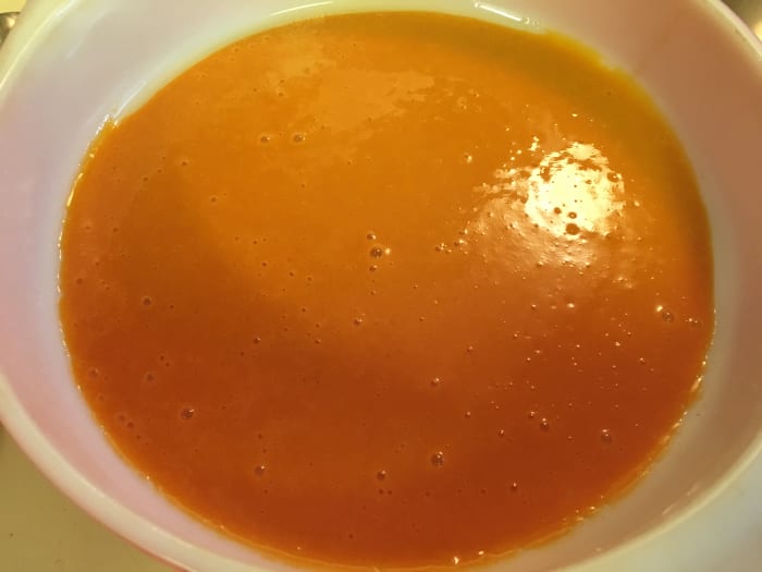 Prepare baking dish with olive oil or non stick spray. Coat bottom of baking dish with red pepper and tomato soup.