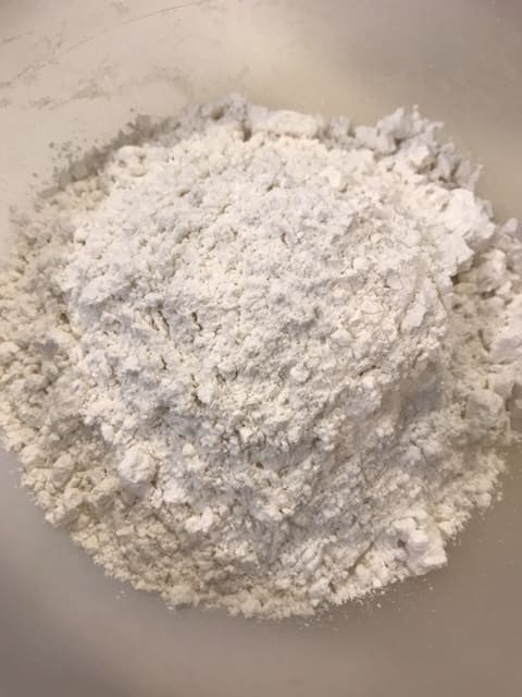 In a second bowl, whisk together the dry ingredients. Cake flour gives a gorgeous texture to the cake, and baking soda provides lift.