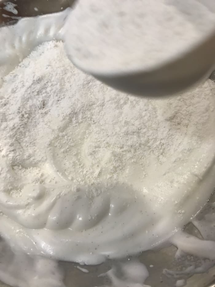Folding is a simple technique - you work with an over and under motion and a spatula to incorporate the flour into the beaten egg whites. This helps insure that the volume stays as high as possible.