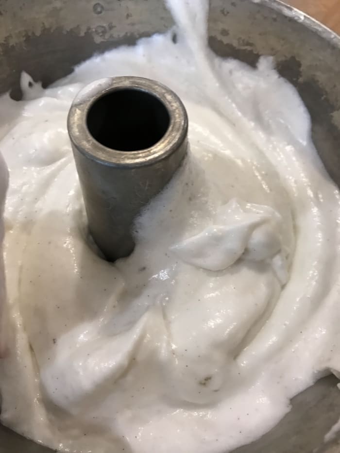 Use a plain, ungreased (not a nonstick) tube pan for your angel food cake. The egg whites will cling to the sides and rise in the oven. I love how the vanilla bean stands out against the start white of the batter.