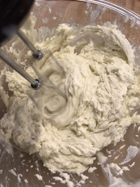Keep working in the milk/flour mixture until it's all incorporated, and the frosting has a smooth, creamy consistency.