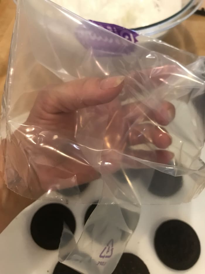 You can use either purchased cake decorating bags, or (much easier and cheaper!) use a baggie and just cut off the corner. I usually use that method!