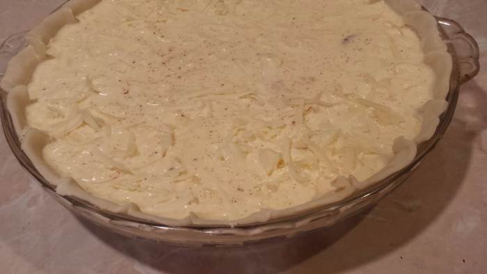 Ensure that filling and egg is evenly distributed, then bake until crust is golden and center is set!