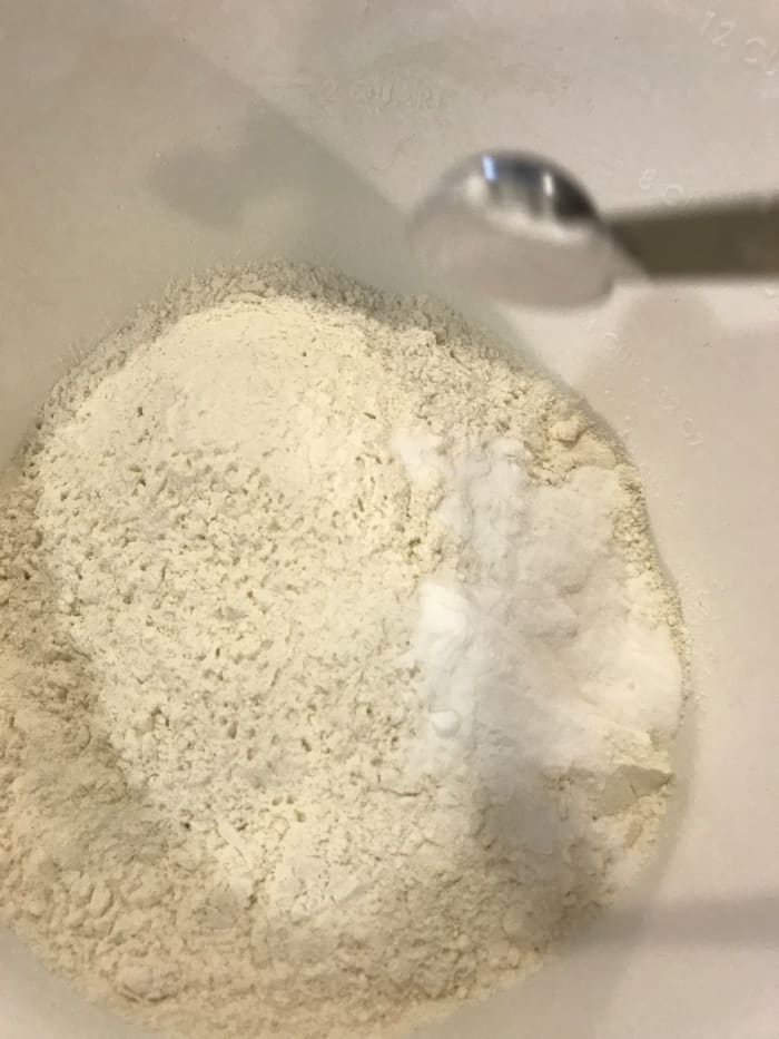 Whisk together flour, baking soda, baking powder and salt in a separate bowl. Set aside while creaming together the butter and sugar.