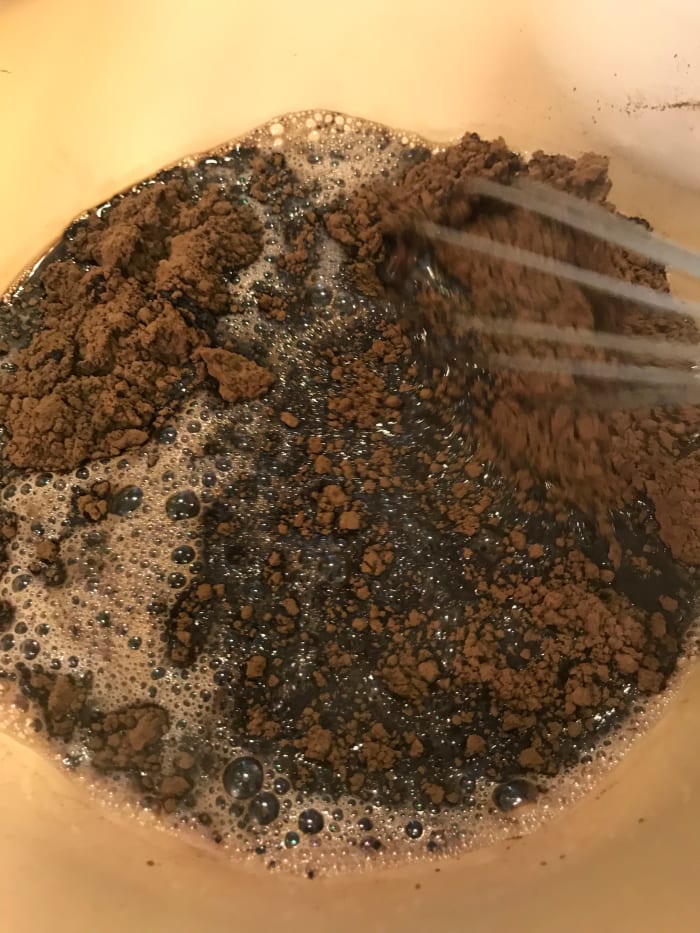 Whisk together the boiling water and cocoa powder until smooth. You'll have a very loose paste. Allow this mixture to cool as you prepare the other ingredients. Whisking occasionally helps it cool faster.