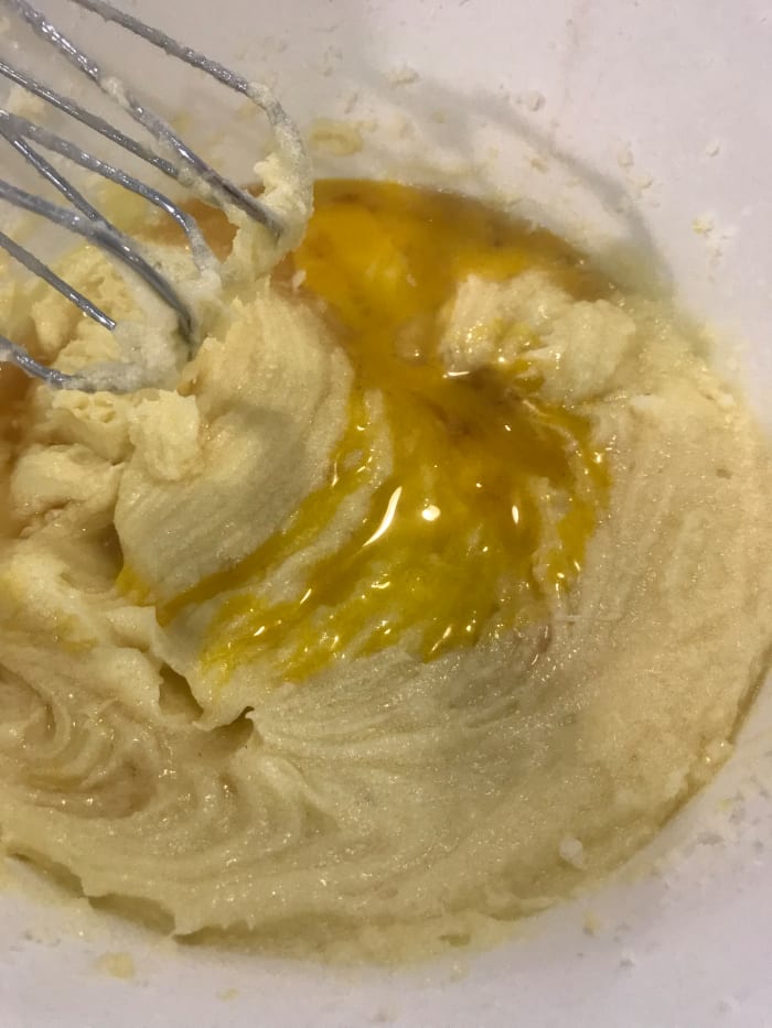 Add the eggs, one at a time, beating well after each addition, and scraping down the sides of the bowl as you work. This helps make sure the batter is silky smooth.