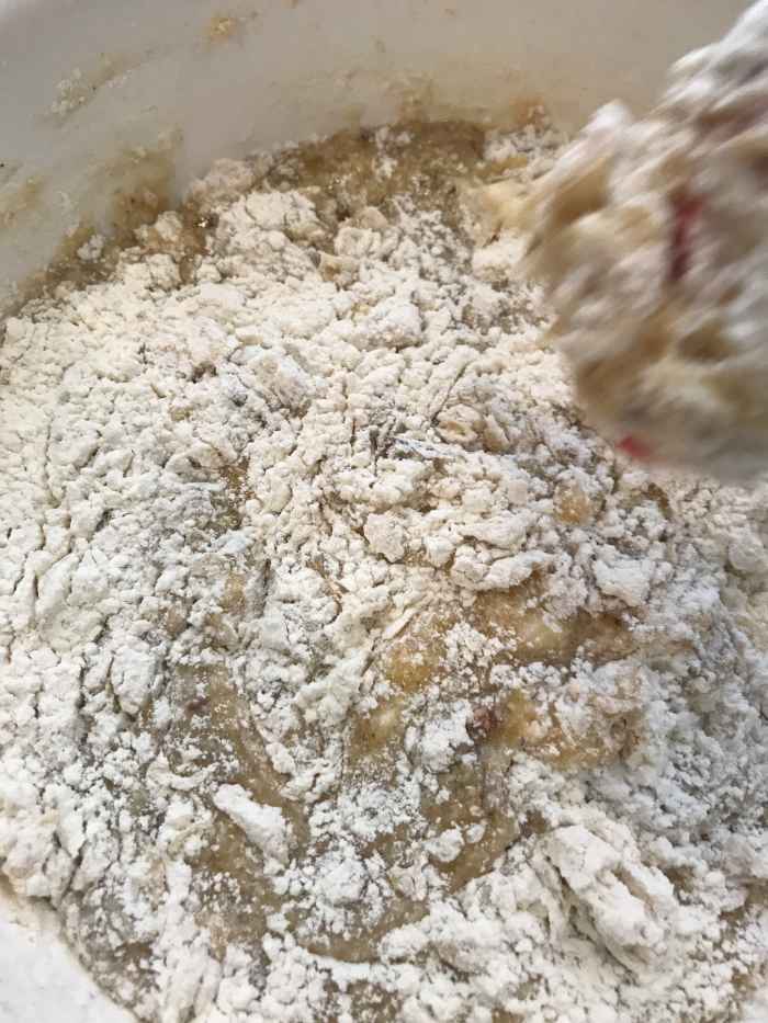 Don't over mix after adding the flour. Stir just until you have no dry pockets and the flour is incorporated. That's it! Stop!