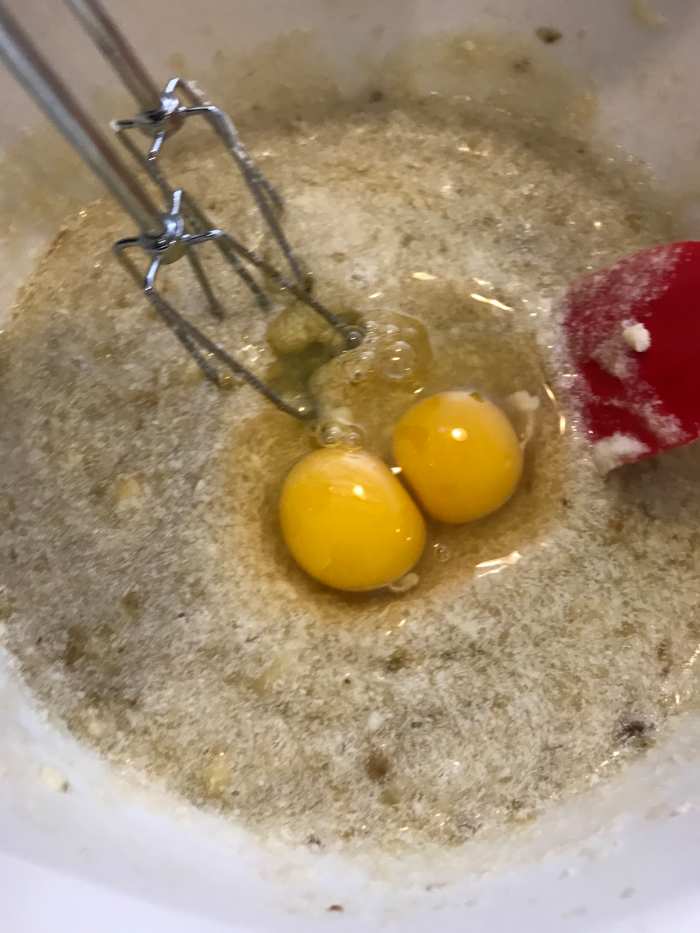 Once the butter and sugar are completely beaten with the bananas, add the eggs, beating after each one and scraping down the sides of the bowl. As you can see, if you accidentally add both at once, the world won't end.