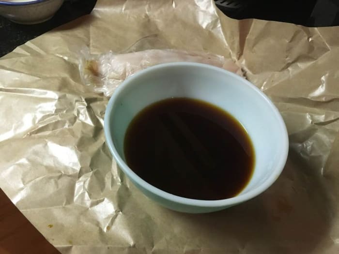 Combine together the white wine, sake, soy sauce, chicken sauce, fish sauce, soy sauce, and sugar, in a bowl. Mix well.