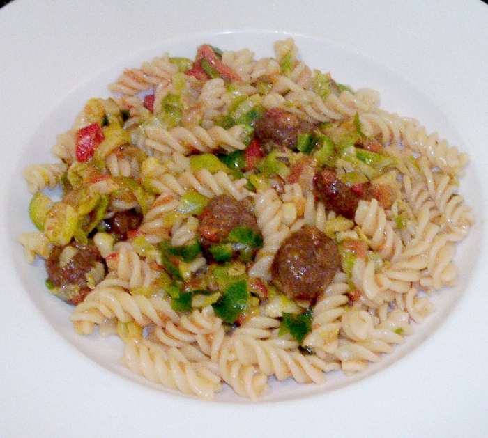 Shredded Brussels sprouts and fusilli pasta are infused with wagyu beef meatballs in tomato salsa sauce
