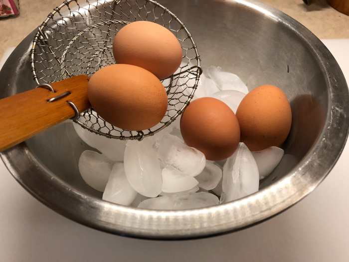 Carefully add eggs to the bowl of ice. Add some water as well from your pot and let sit for 5 more minutes.