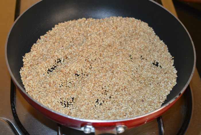 Step one: Put them in a deep-bottomed pan. Turn on the stove. Keep the heat low. Dry fry them till light golden brown while turning them often. Next, turn off the heat. Set aside for cooling.