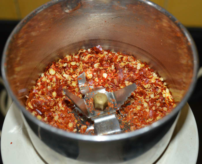 Step two: Pulse the mixer 2-3 times for very short period. Otherwise, if you run it for a longer time, you may get chili powder instead of chili flakes. You should be careful in this step. Pulse until you get the needed consistency.