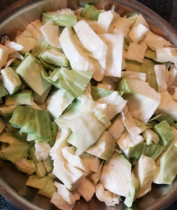 Chop cabbage into rough squares. Place in a skillet with a little oil to coat the bottom of the pan. Fry over medium heat, stirring occasionally.