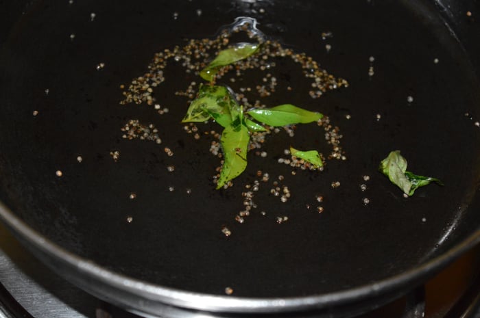 Step one: Heat two teaspoons oil in a pan. Throw in mustard seeds. Let them crackle. Add curry leaves. Saute for 5 seconds.