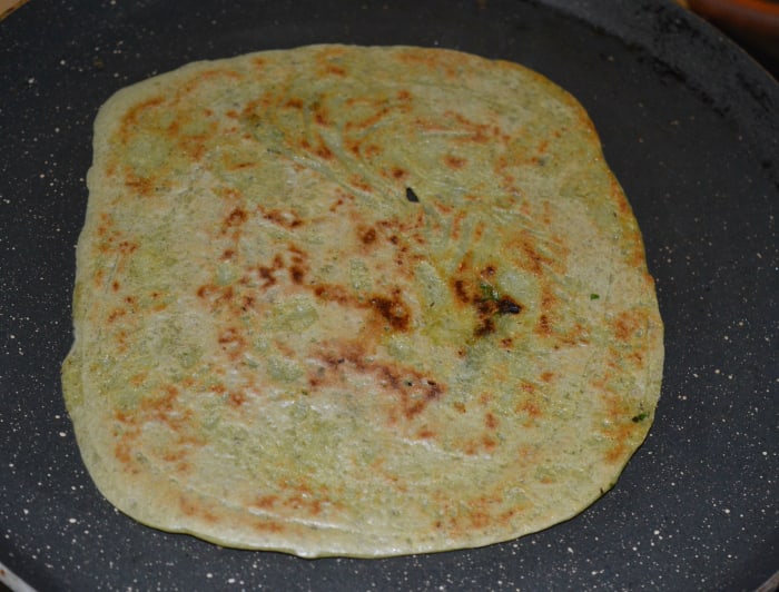 Step six: Let the bottom become golden brown. Flip it. Cook till the other side is also golden brown. Next, remove the pancake and place it on a serving plate.
