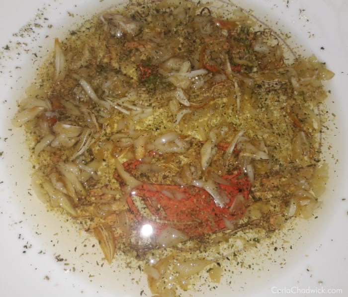 This admittedly looks a little gross, but it's the oil, salt and garlic mixture that will give your rolls their flavor
