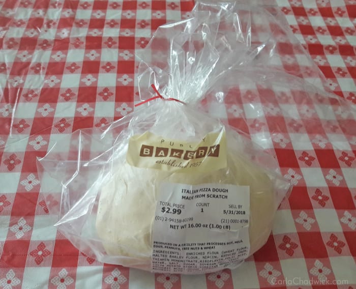 Pre-made pizza dough from the grocery store or Whole Foods is surprisingly good and makes preparation of this recipe go much faster