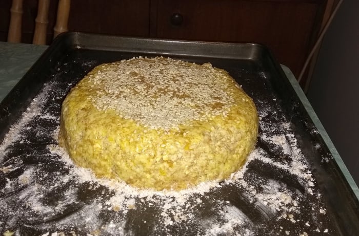 Spoon out onto a floured baking tray and shape with a dessert spoon and wooden spoon. Alternatively, knead into a flattened ball on a work surface before transferring to the tray.