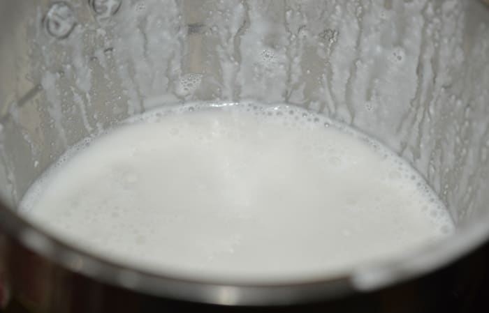 The rice-coconut paste will look like this. Add salt as per instructions. Thin the batter by adding some water.