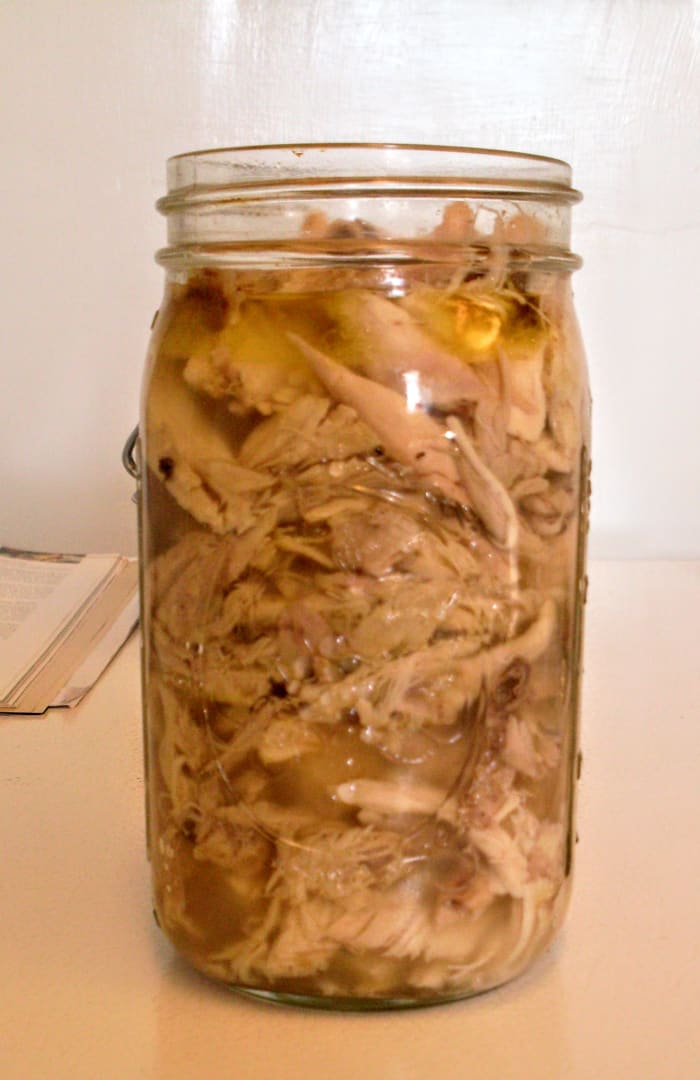 This is what a full jar of chicken will look like. The measurement at the top is called the required headspace, and allows the product to expand during boiling.