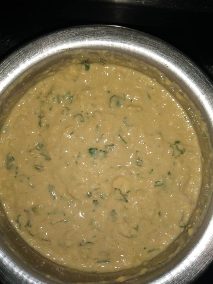Mix everything properly without forming lumps, and add water to form batter of dropping consistency.