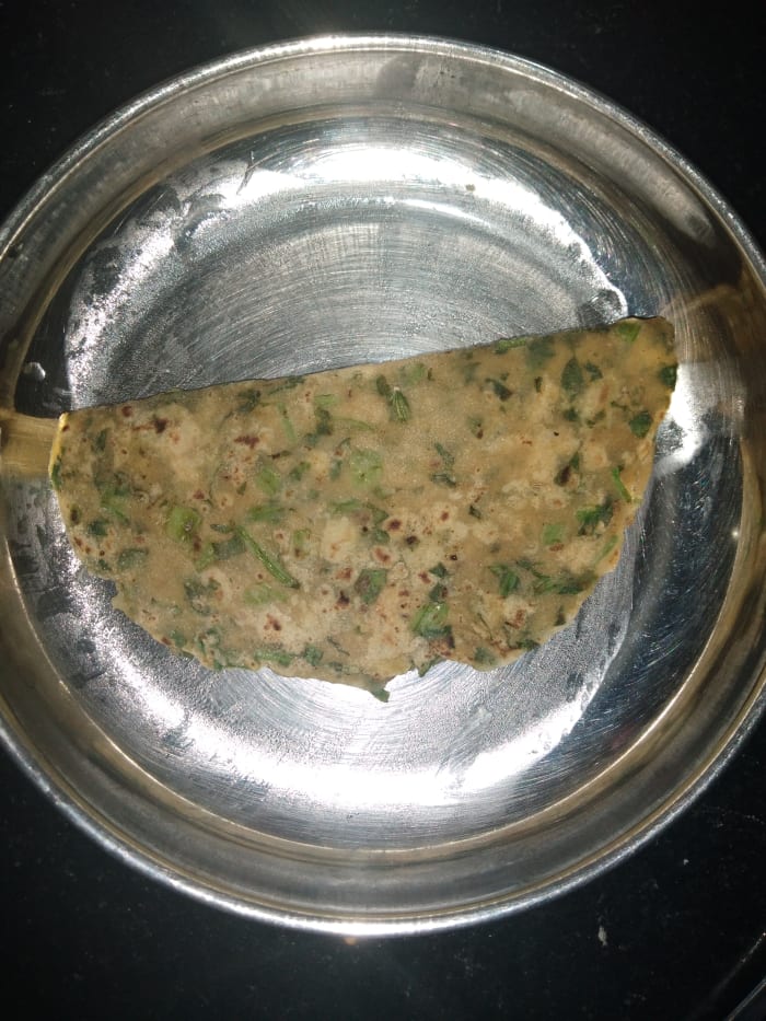 Heat tawa and place the tepla on it. Cook on medium to high flame, flipping and cooking on both sides while applying ghee or oil. Serve hot.