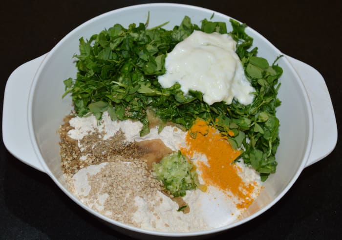 Step one: As per instructions, add all of the ingredients to a large mixing bowl. Knead, adding just enough water to make a firm and pliable dough.