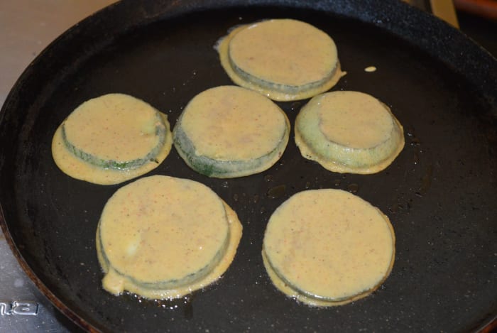Step three: Dip each slice in the batter and place on a greased hot flat pan. Roast both sides, adding a few drops of oil and flipping the slices once or twice.