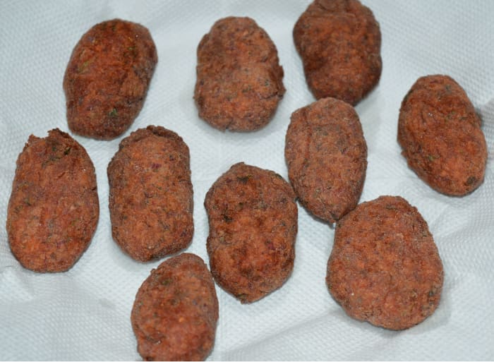Step five: Deep-fry them in medium-hot oil. Turn them occasionally to fry them uniformly. Remove them on an absorbent paper when they turn golden brown and crispy.