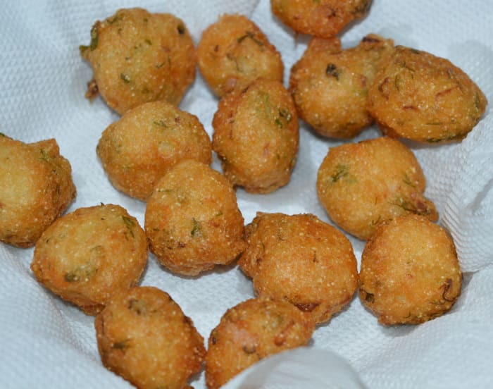 Fry them while turning occasionally. Remove once they turn golden and crunchy. Place them on an absorbent paper towel. The hot idli batter fritters (punugulu) are ready to munch!
