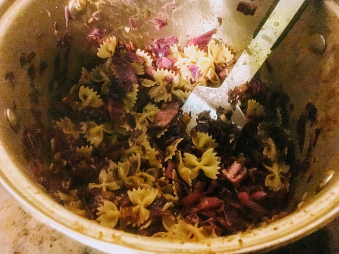 As the stir-fry nears completion, it will look a bit glossy and disorderly. Scrape down the sides if you are using a pot, or bits of cabbage will dry out.