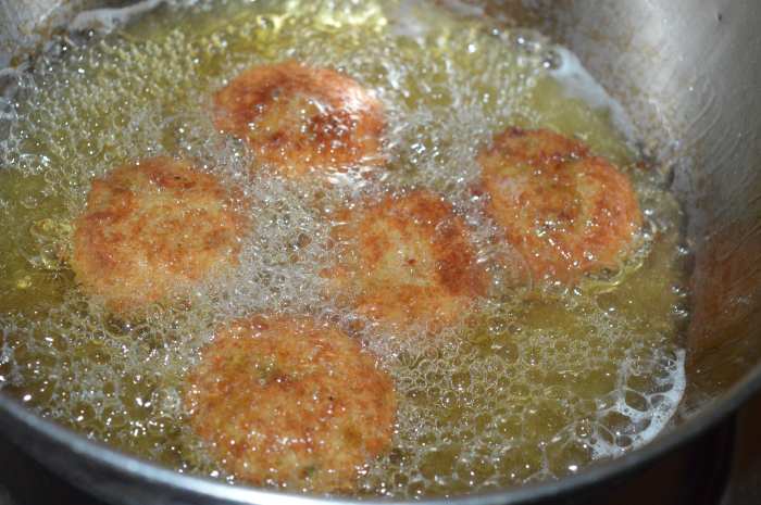 Step six: Slide a few of them into the hot oil. Deep-fry them until they turn golden brown and crispy.