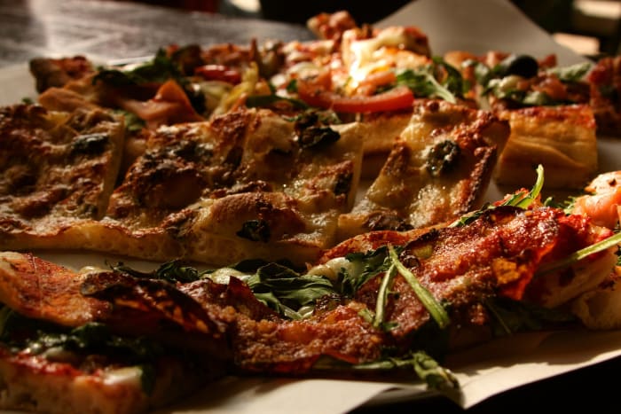 Focaccia, invented circa 700 BC by the ancient Etruscans, is one of the ancestors of pizza that is still eaten today.