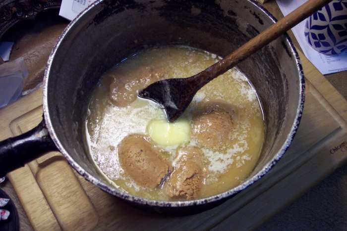 After dropping in the butter and peanut butter, briefly allow them to melt a little. But don't expect them to dissolve completely before starting to beat. Don't wait much longer than two to four minutes.