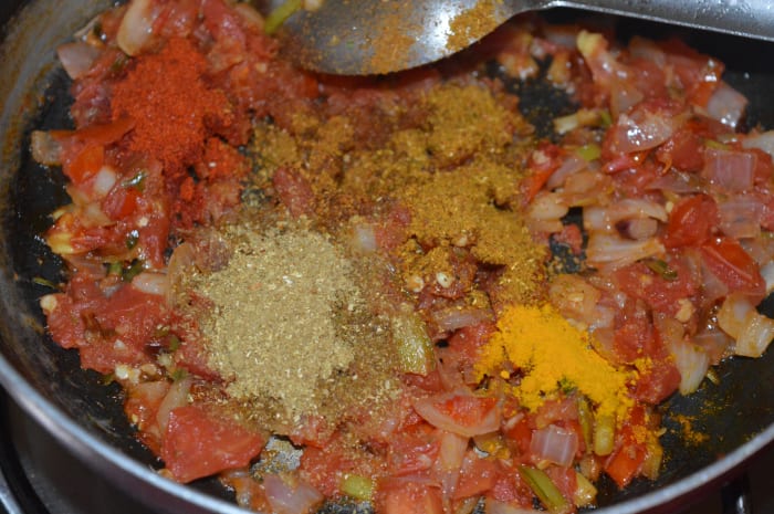 Step three: Add the dry spices: turmeric powder, red chili powder, coriander powder, and garam masala powder. Saute for 1 minute.