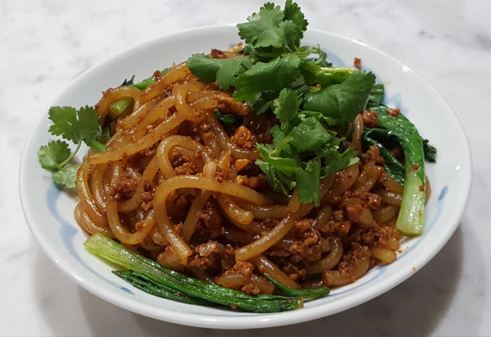 Fat Rice Starch noodles tossed with dongcai minced pork and shitake mushroom sauce: a sort of Asian "spag bol"!