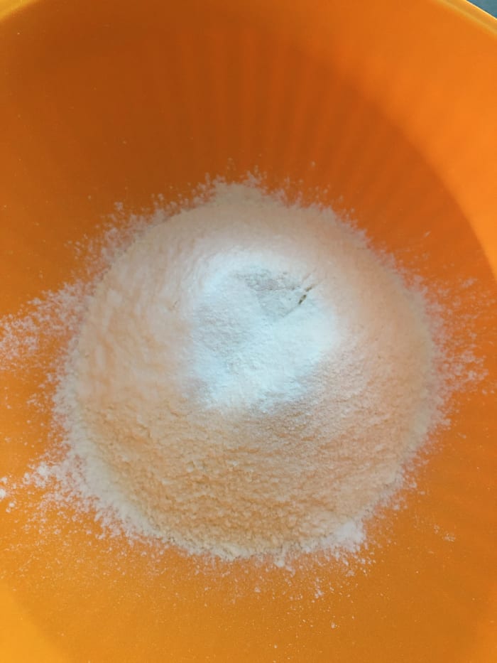 In a mixing bowl, combine the flour, salt, baking soda, and baking powder. Mix it all together with a spatula or whisk. Set aside.