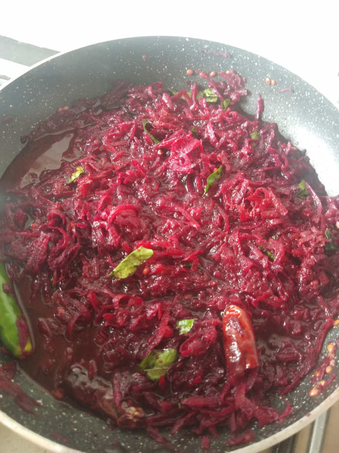 Add 1/2 cup of water. Close the lid and let it cook over medium flame. Check and stir in between. Add more water if required.