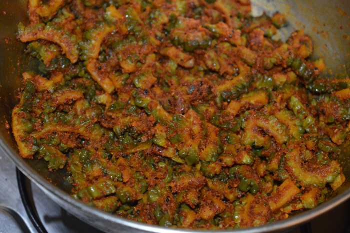 Check for taste. If needed, add some salt. Mix once again. Turn off the heat. Your favorite spicy bitter gourd curry with peanut masala is ready!